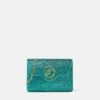 Bolso de mano de satén con adornos La Medusa
