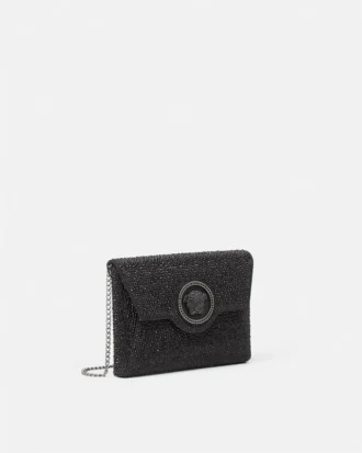 Bolso de mano de satén con adornos La Medusa