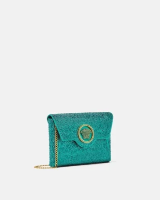 Bolso de mano de satén con adornos La Medusa
