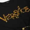 Camiseta corta con imperdibles y pin de seguridad