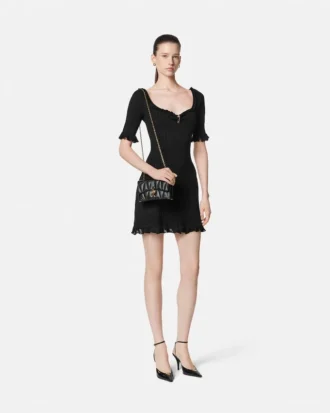 Mini vestido acampanado de punto con imperdible