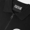 Polo con cremallera y emblema en V Polo con cremallera y emblema en V
