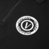 Polo con cremallera y emblema en V Polo con cremallera y emblema en V