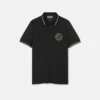 Polo con emblema V bordado Polo con emblema V bordado