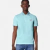 Polo con Medusa bordada Polo con Medusa bordada
